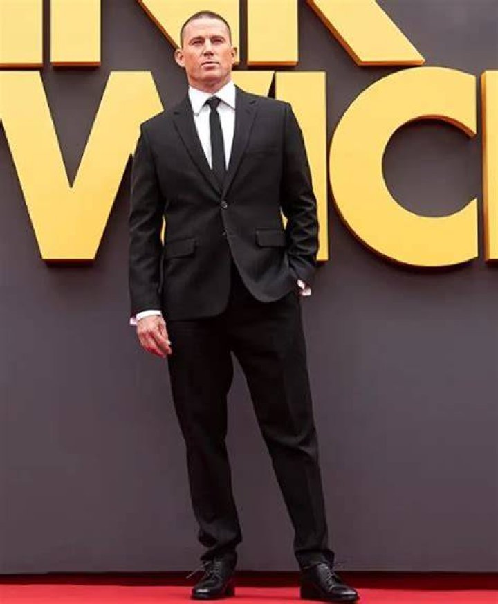 Channing Tatum in a suit while at a media event.