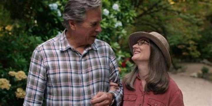 Doc and Hope walk arm in arm in season four of Virgin River