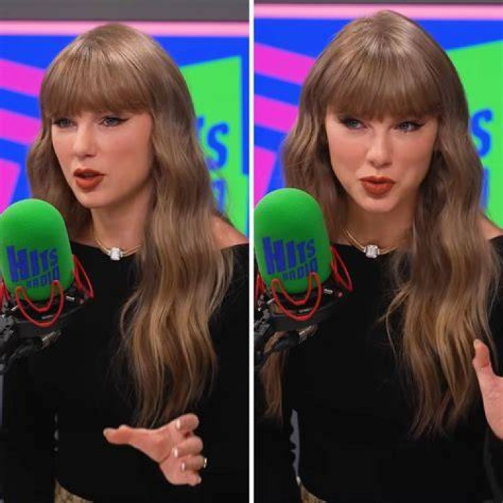 Taylor Swift speaking into a mic while holding a Grammy, her team celebrating behind her